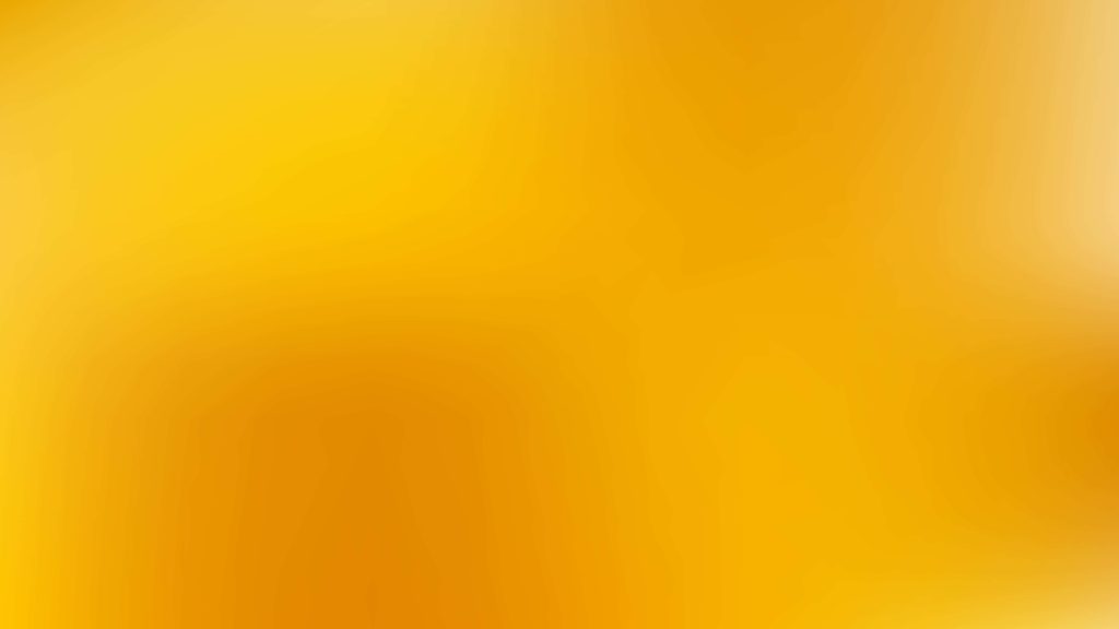 Warm glowing abstract wallpaper with smooth yellow and golden orange gradient background