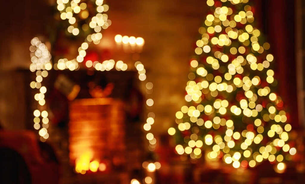Cozy Holiday Wallpaper: Warm Christmas Tree & Inviting Fireplace
