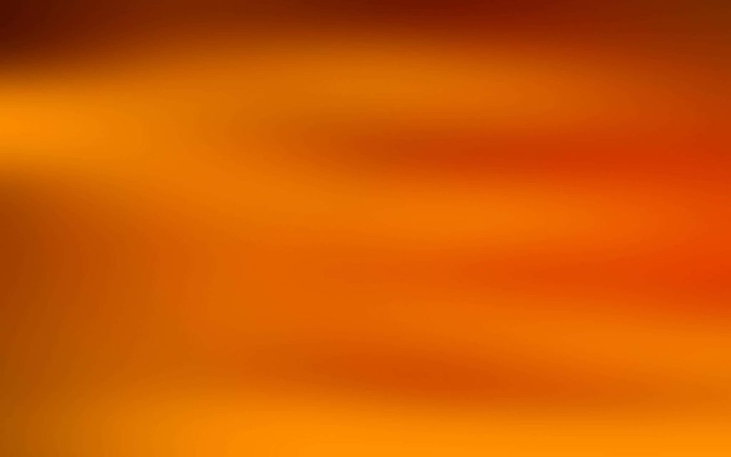 Warm light orange abstract gradient wallpaper with soft sunset glow for minimalist background