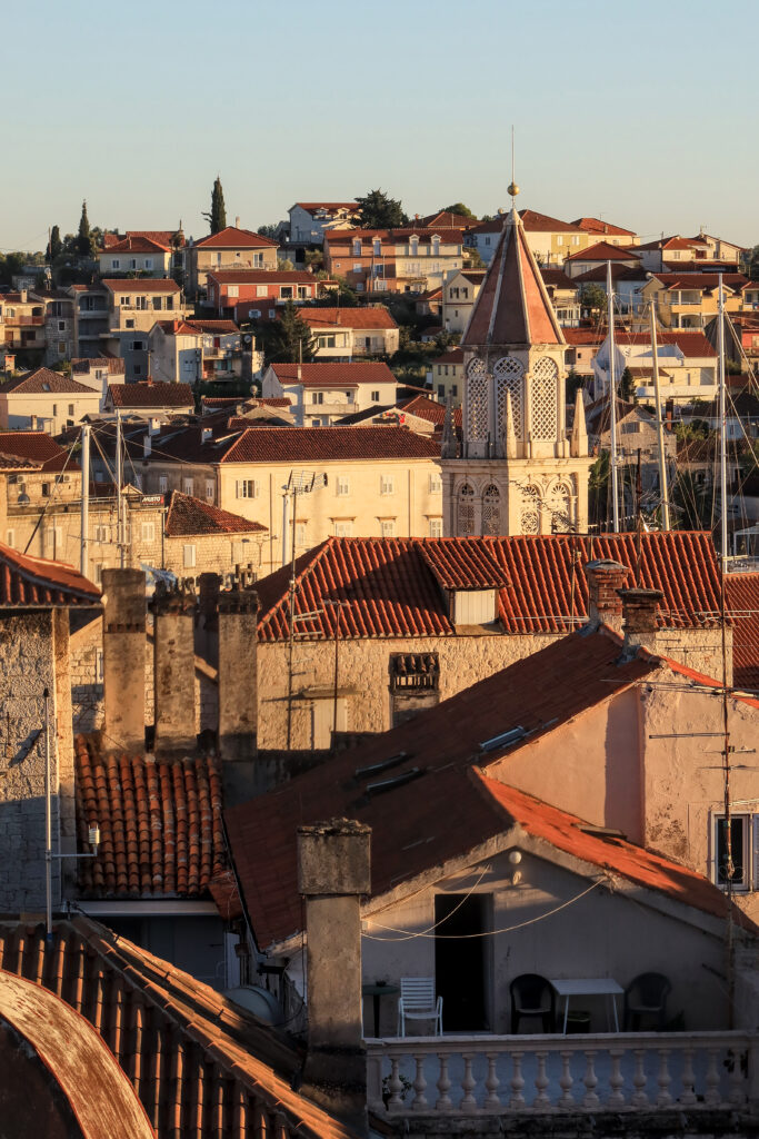 Golden Hour Mediterranean Cityscape Wallpaper with Tiled Roofs