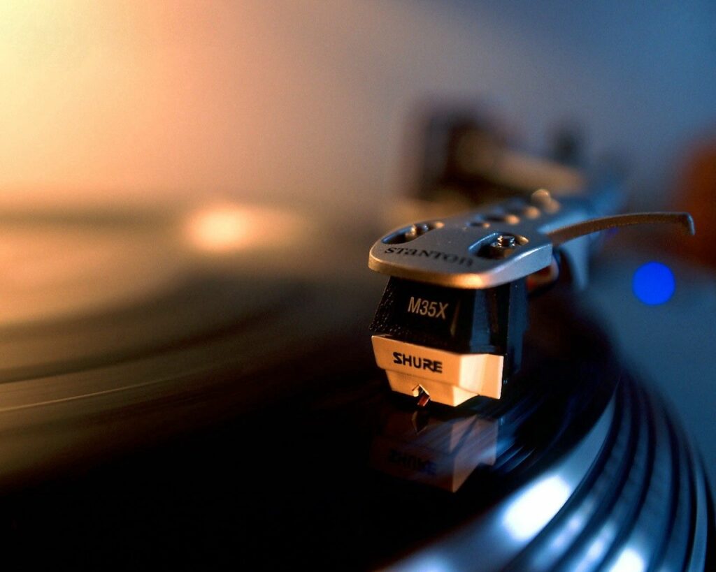 Warm Vinyl Record Player Close-Up: Moody Wallpaper Background