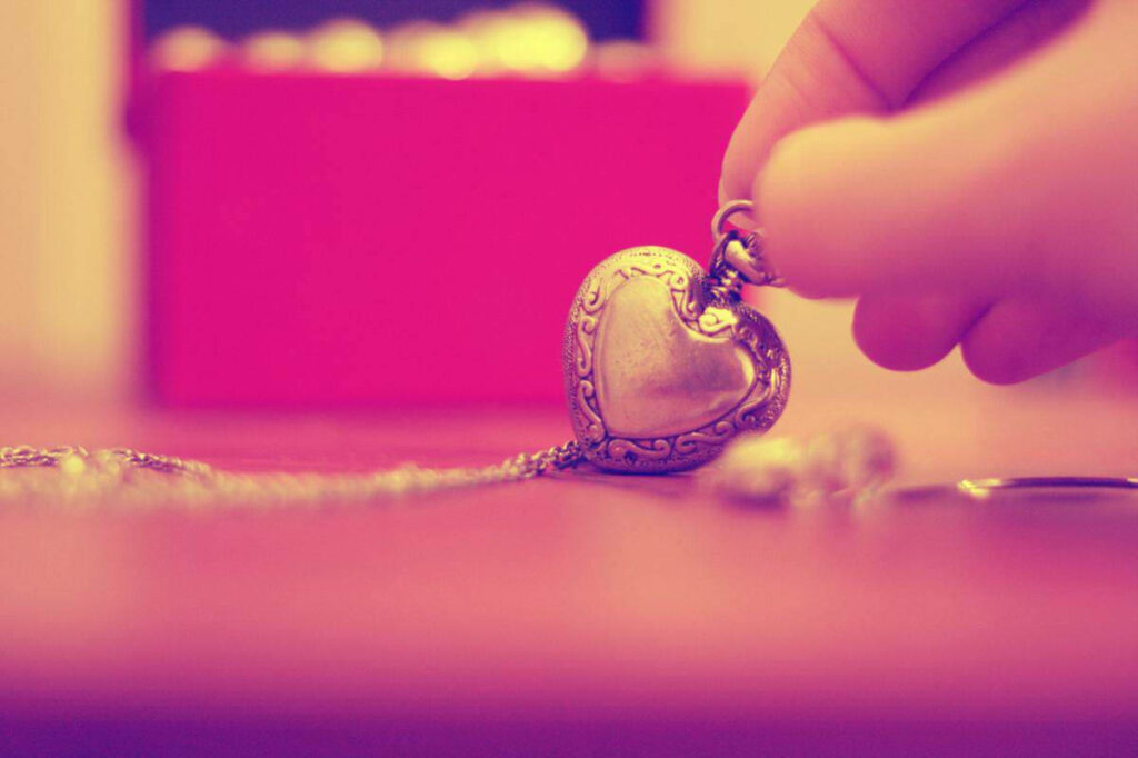 Warm Nostalgic Sepia Wallpaper with Heart-Shaped Locket