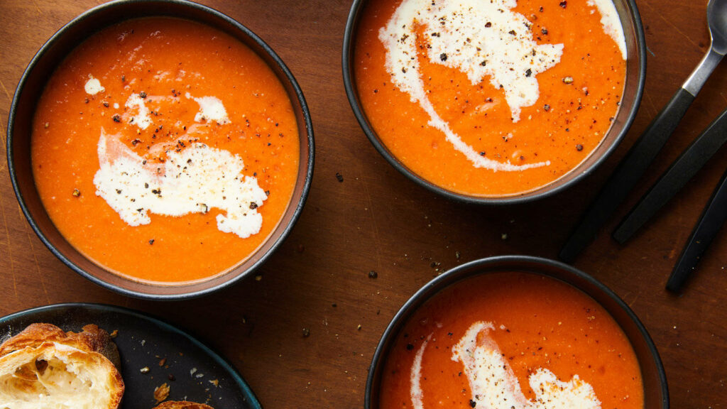 Cozy Tomato Soup Wallpaper: Vibrant Bowls & Rustic Bread Background