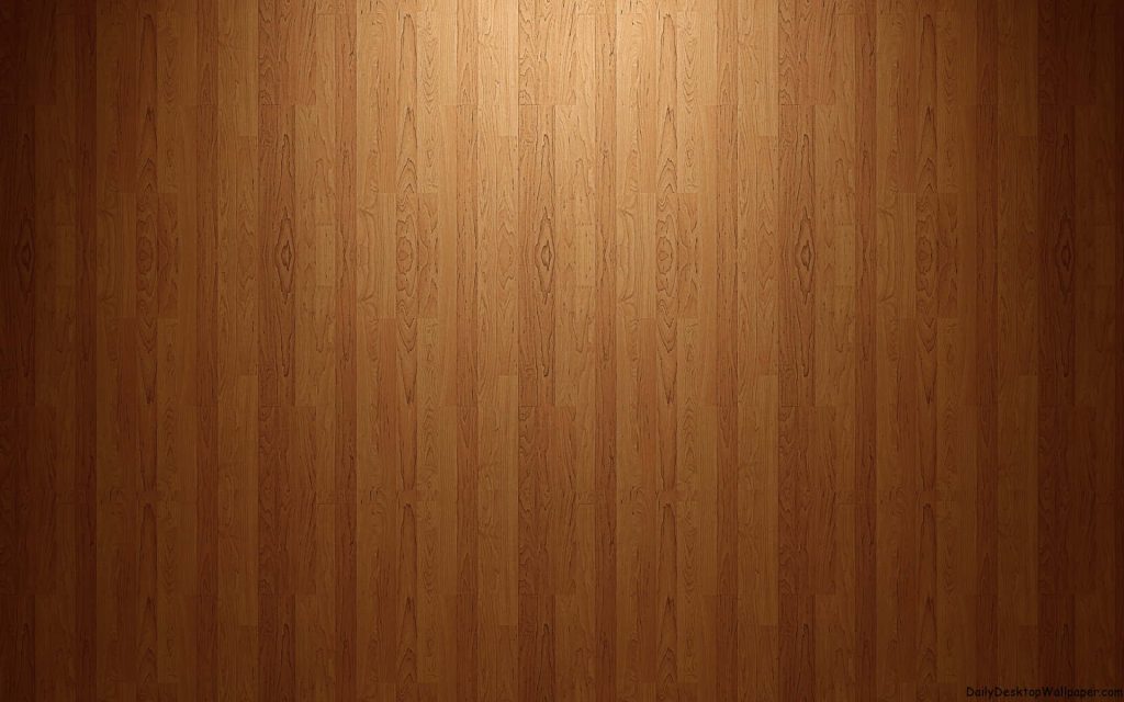 Warm wood panel background with vertical grain and soft centered spotlight lighting Wallpaper