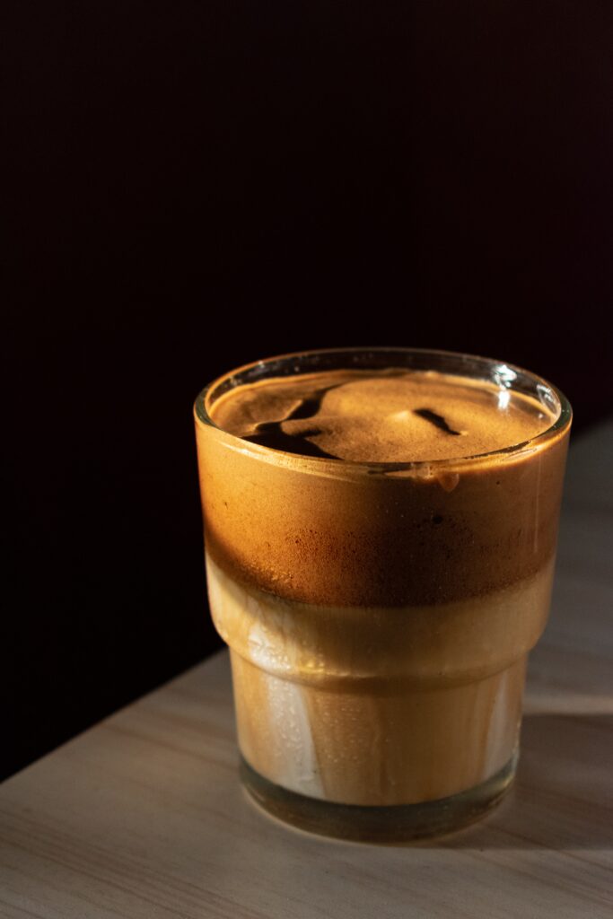 Cozy Coffee Drink Wallpaper: Warm Glass on Smooth Wood Background