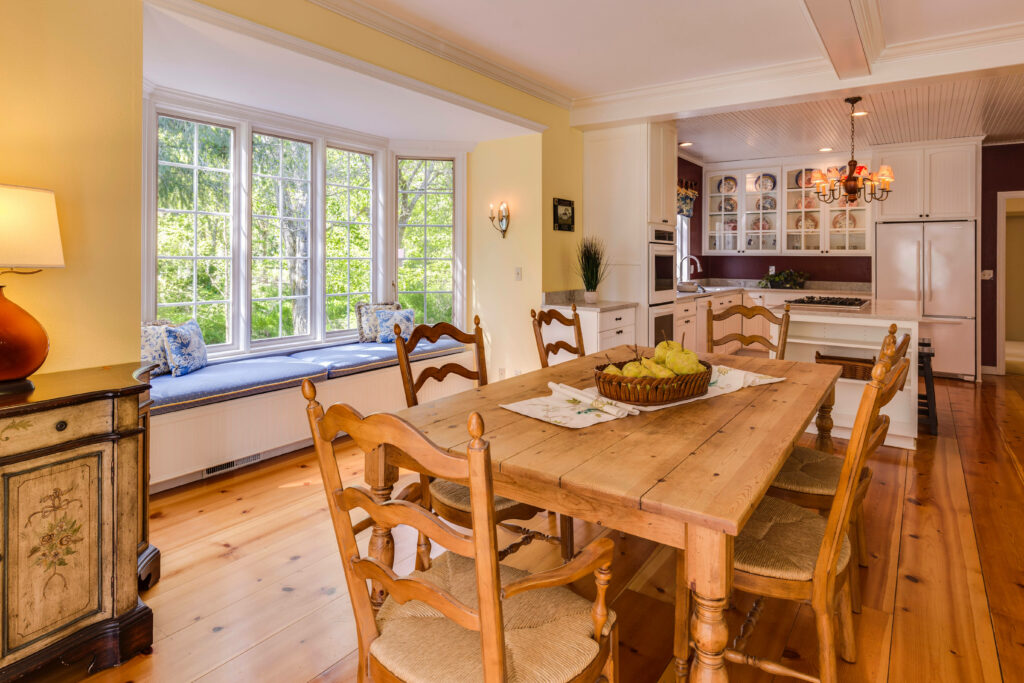 Warm and Rustic Kitchen Bliss: A Natural Wood Haven with a Relaxing Window Seat Wallpaper