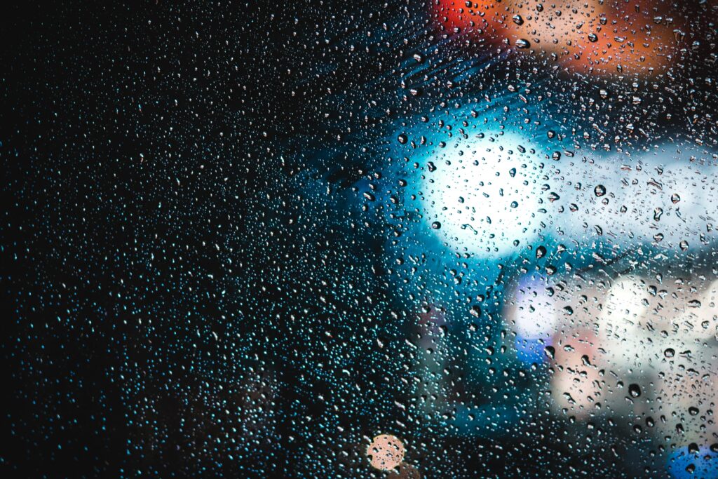 Water Drops on Glass: Captivating Bokeh Wallpaper Background