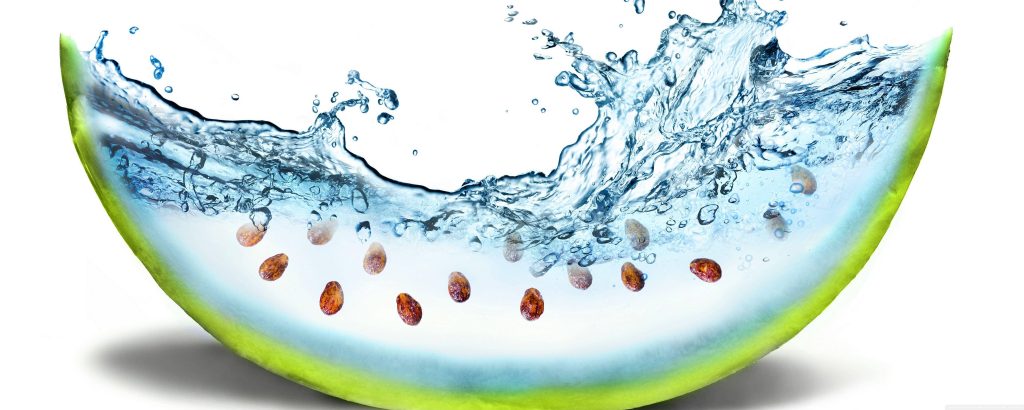 Watermelon slice transformed into vibrant water splash with seeds and green rind on white background Wallpaper