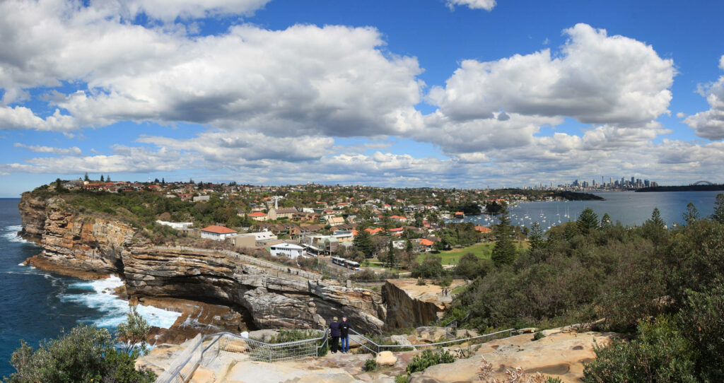 Watsons Bay Sydney coastal cliffs ocean sparkling blue water city skyline bright sky wallpaper
