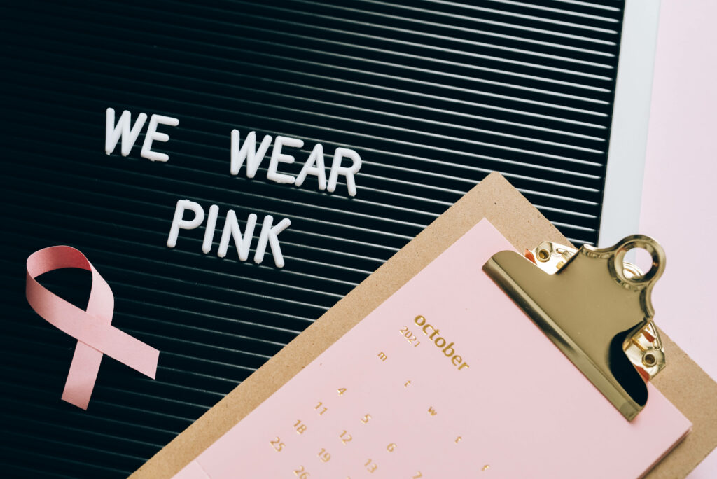 Breast Cancer Awareness wallpaper with We Wear Pink message pink ribbon and October calendar
