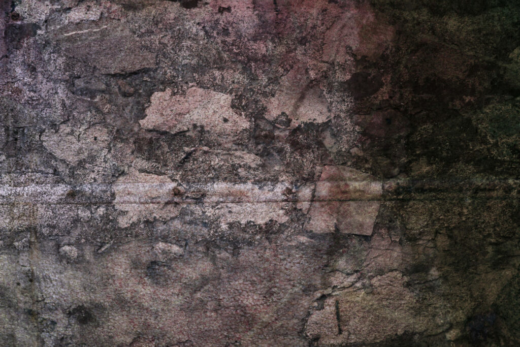 Rugged Aged Wallpaper Design: Textured Old Stone Wall Background