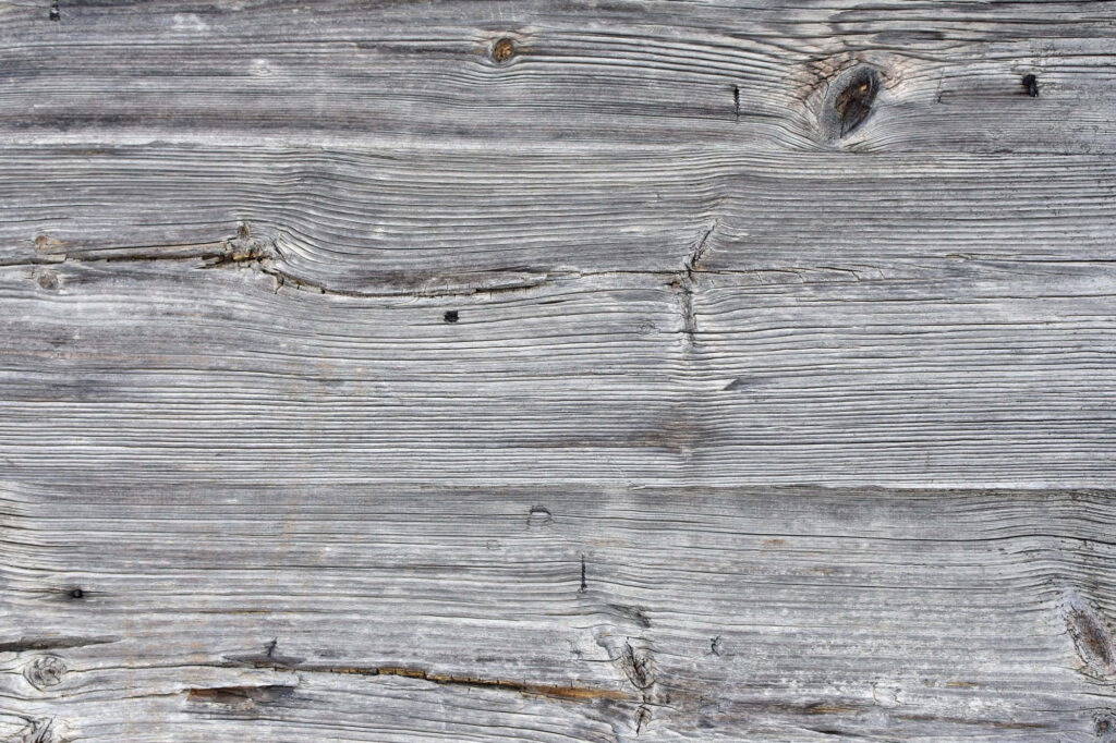 Close-Up of Weathered Gray Wooden Wall - Textured Background Wallpaper