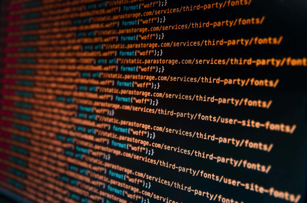 Web Development Wallpaper: Coding Lines on Screen Background