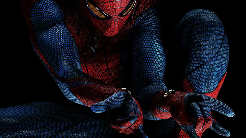The Web-Slinger: Spiderman Strikes a Badass Pose in the Shadows Wallpaper