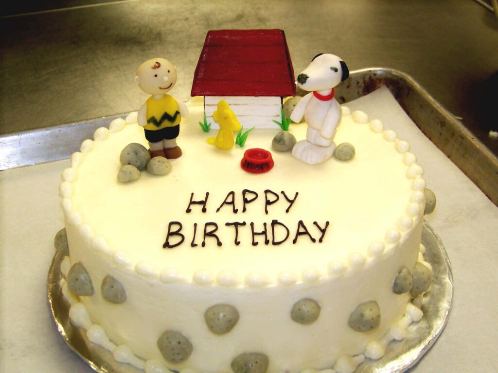 Whimsical Birthday Cake Wallpaper with Fondant Figures & Festive Vibe