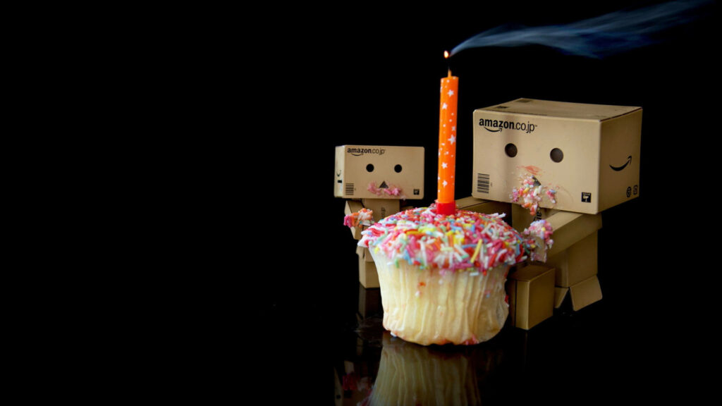 Whimsical Birthday Wallpaper with Adorable Box Characters and Cupcake