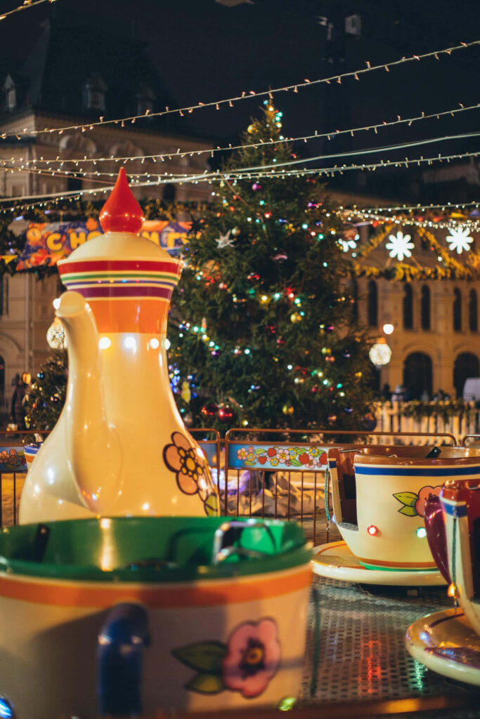 Whimsical Christmas Carousel & Decorated Tree: Holiday Magic Wallpaper