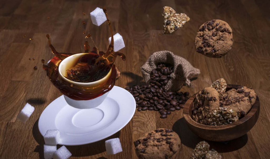 Delightful Moments: A Whimsical Arrangement of Coffee and Cookies Wallpaper