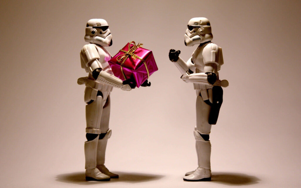 Whimsical Holiday Scene: Action Figures Exchange Pink Gift in Minimalism Wallpaper
