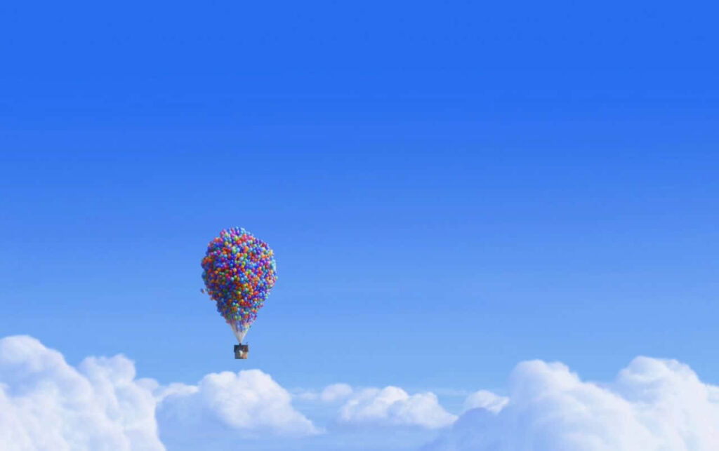 Whimsical House in the Sky: Colorful Balloon Wallpaper Background
