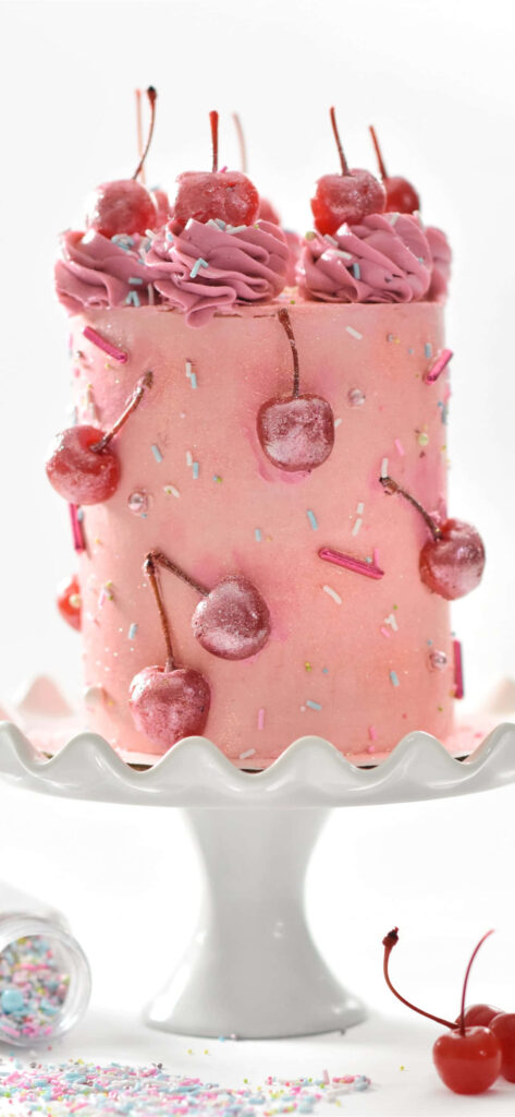 Whimsical Pink Cake Wallpaper with Cherries & Sprinkles on Stand