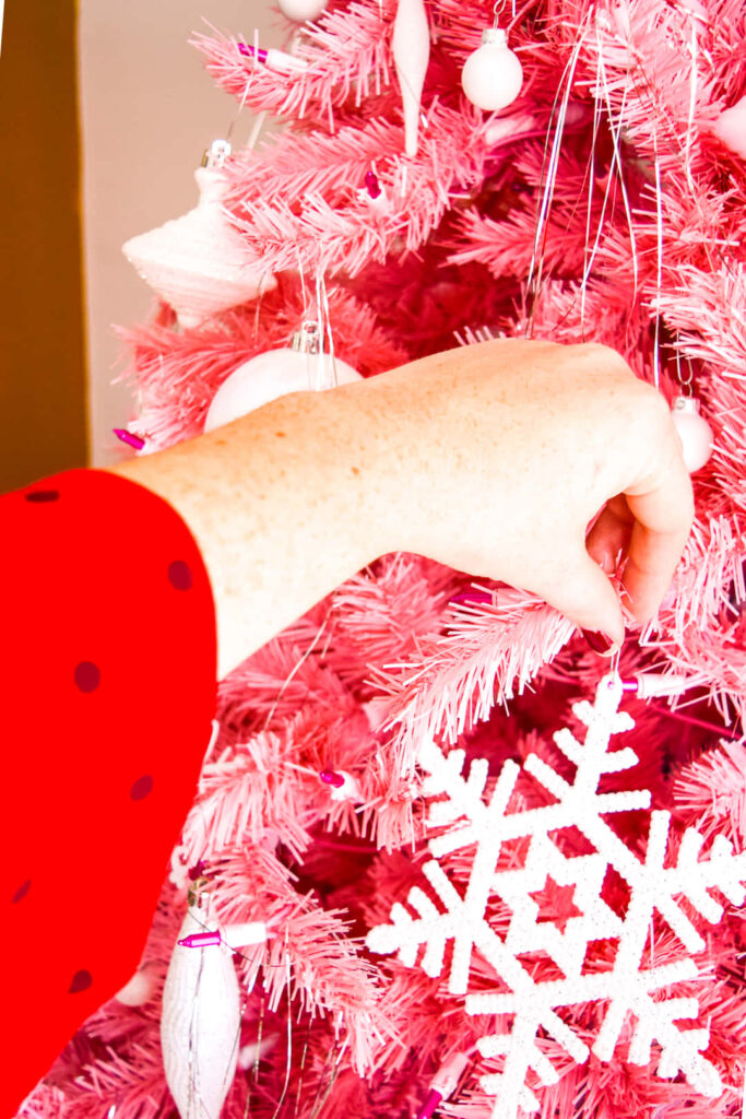 Whimsical Pink Christmas Tree Wallpaper with White Ornaments