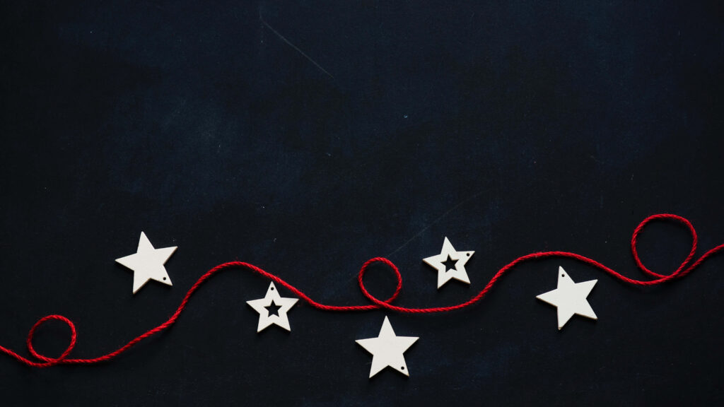 Whimsical Dark Wallpaper with Star Cutouts & Curled Red String