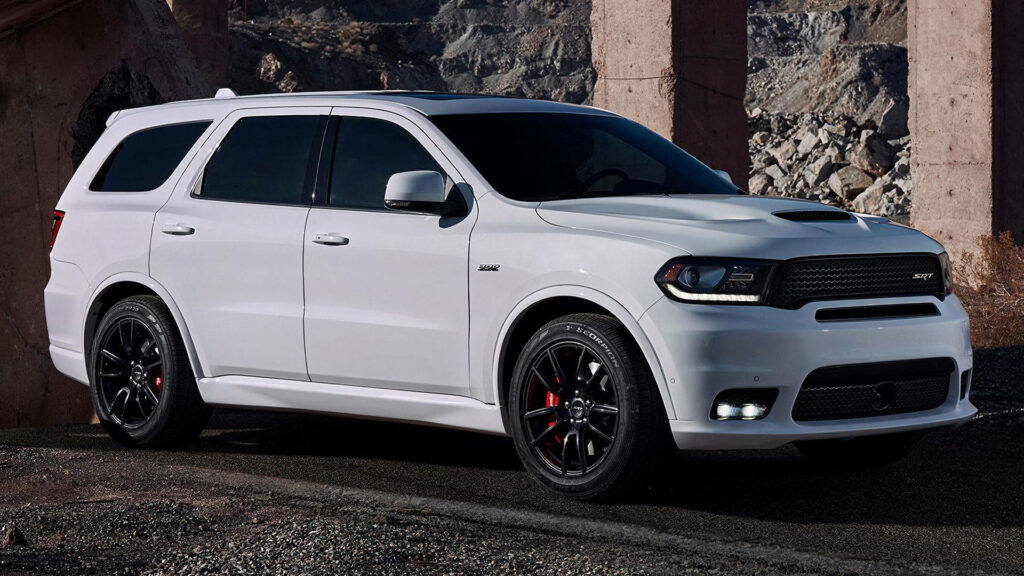 White Dodge Durango SUV with black wheels in rugged outdoor background wallpaper design