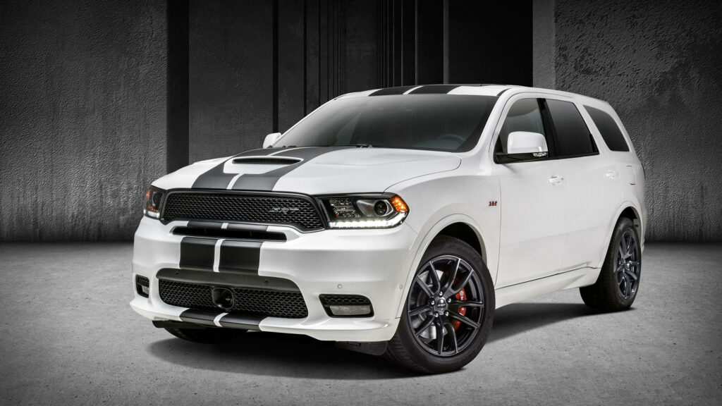 White Dodge Durango SUV with black racing stripes in studio highlighting sporty modern design Wallpaper