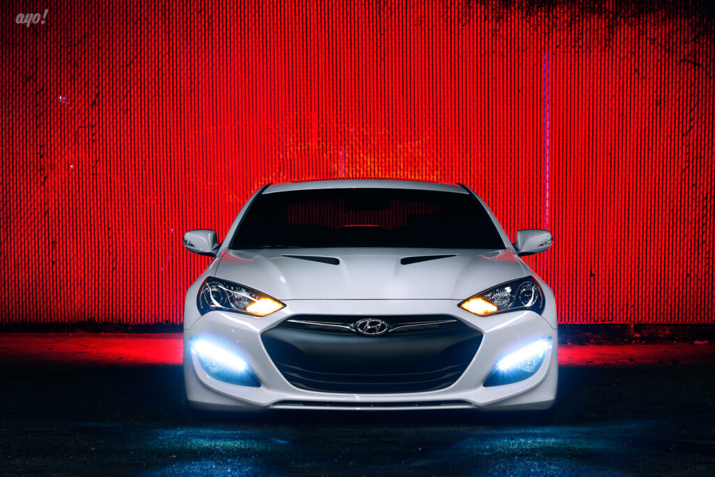 White Hyundai Genesis with Tuning Mod Against Red Background Wallpaper
