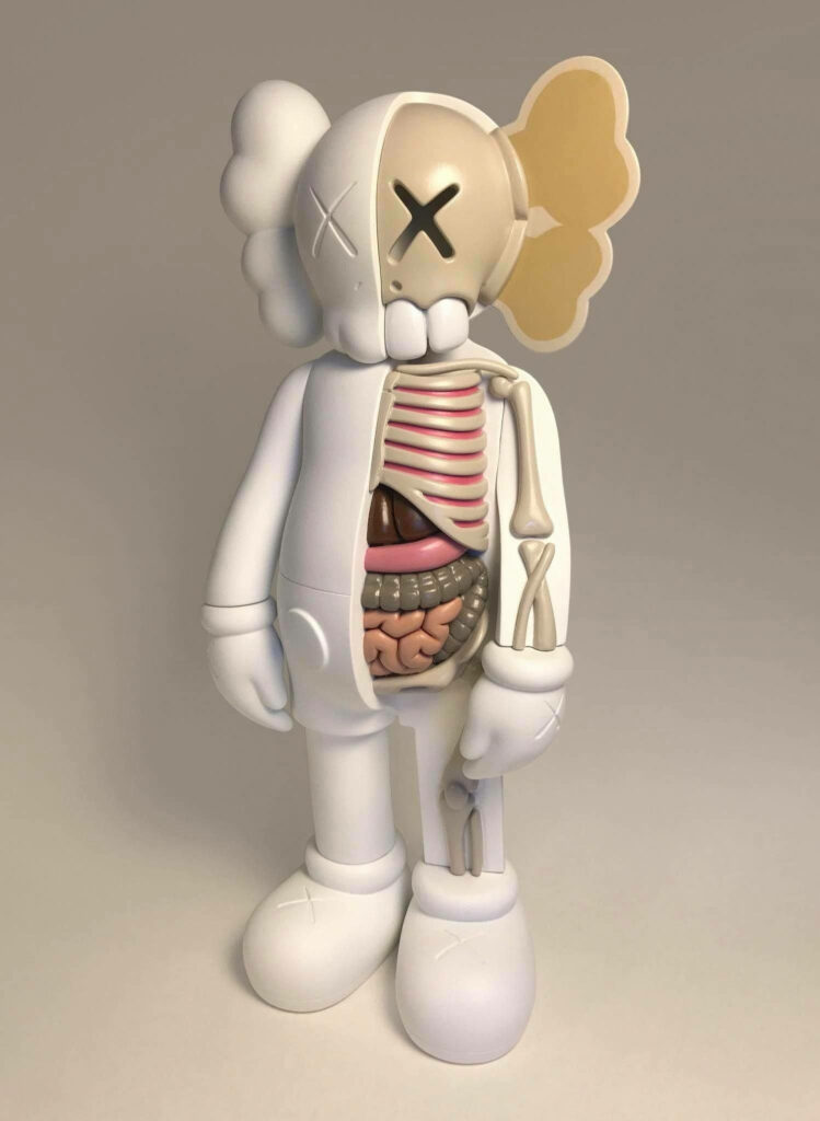 White KAWS Dissected Companion figure showing detailed anatomy on neutral wallpaper background