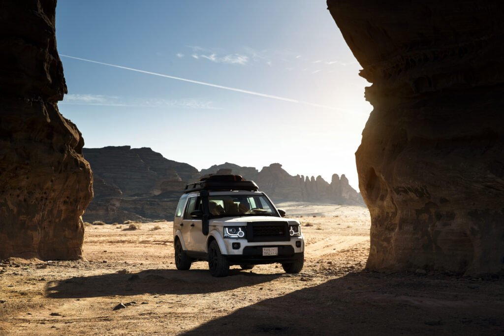 White Land Rover SUV against Hejaz Railway - Adventure Wallpaper