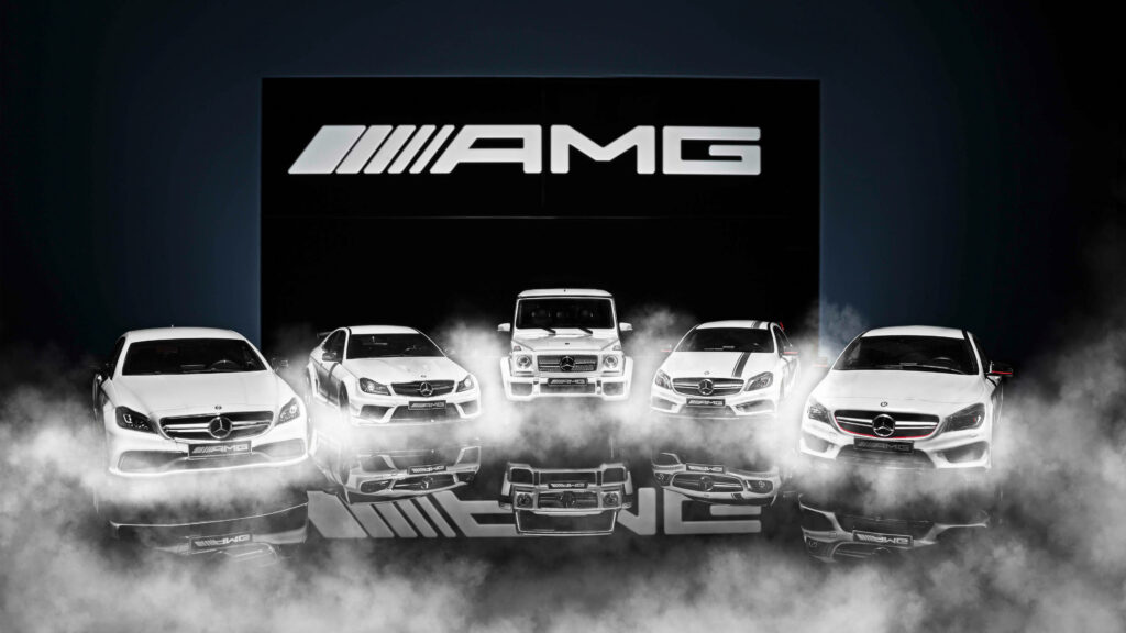 White Mercedes AMG cars lined up with AMG logo fog and reflections luxury performance wallpaper