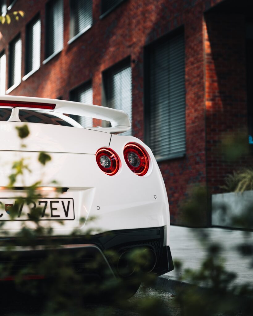 Stylish White Sports Car Wallpaper: Urban Scene & Sleek Design
