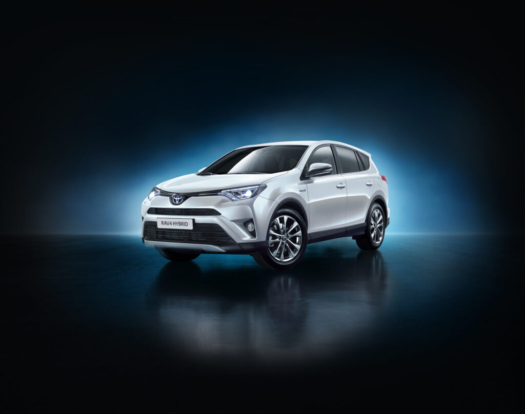White Toyota RAV4 Hybrid - US-Spec Model on Minimalist Background Wallpaper