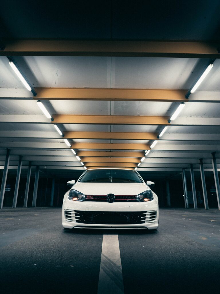 Stunning White Volkswagen Golf GTI Front View Wallpaper Under Lights