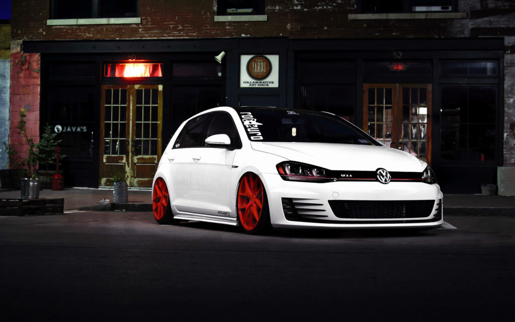 White Volkswagen Golf with red rims parked urban night sporty car high resolution wallpaper