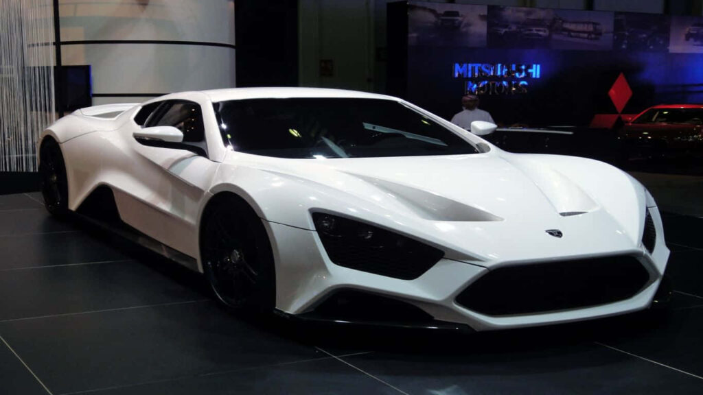 White Zenvo sports car with aerodynamic sleek design showcased at auto show wallpaper background
