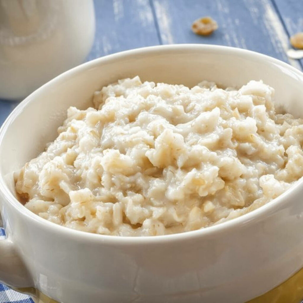 Cozy Oatmeal Bowl: Wholesome Breakfast on Rustic Wood Wallpaper