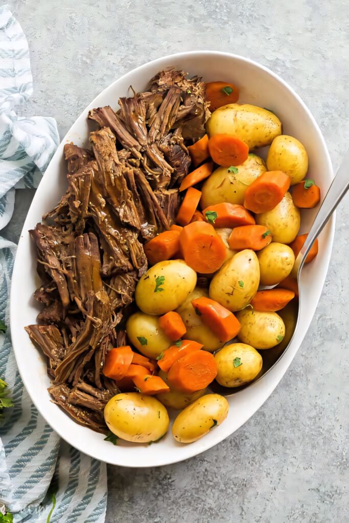 Delicious Shredded Beef Bowl with Baby Potatoes & Carrots Wallpaper