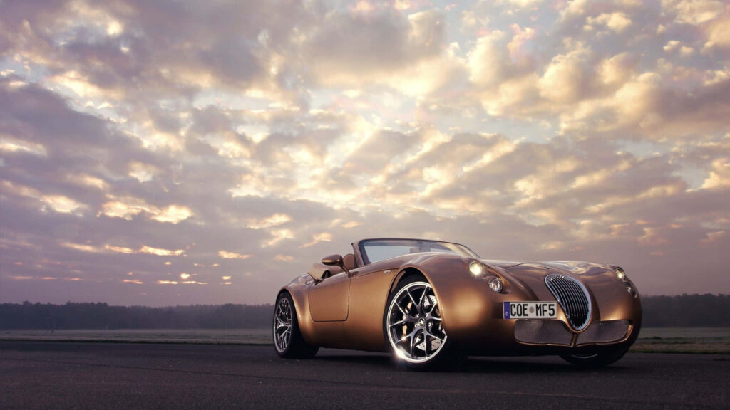 Wiesmann convertible sports car at sunset with sleek design and polished metallic finish wallpaper
