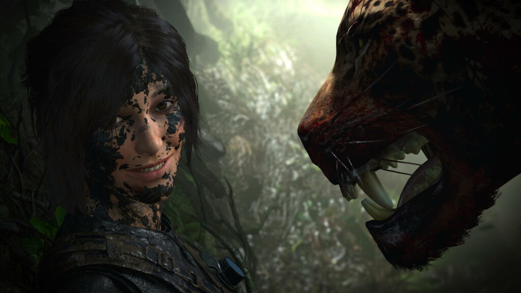 Mud-spattered Lara Croft fearlessly grinning alongside a menacing jungle jaguar in the thrilling world of Shadow of the Tomb Raider Wallpaper
