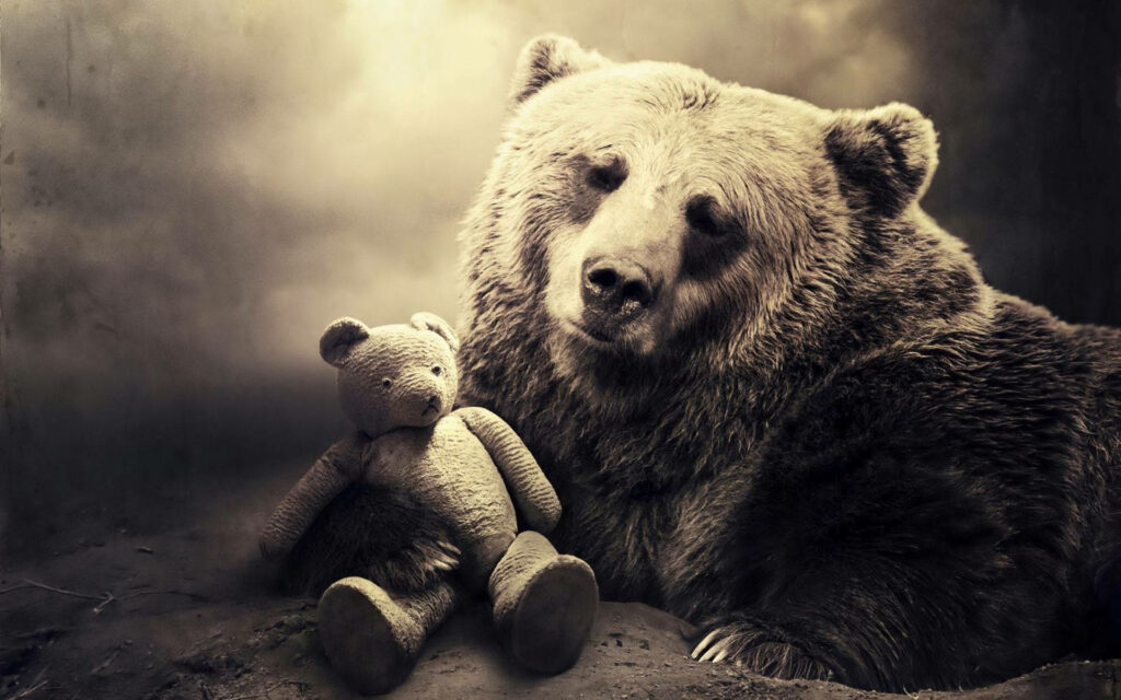 Majestic Wilderness Embrace: A Grizzly Bear's Tender Touch with a Teddy Bear Wallpaper