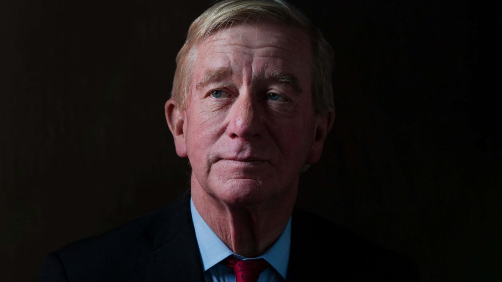 William Weld professional portrait in sharp suit low-key lighting contemplative expression wallpaper