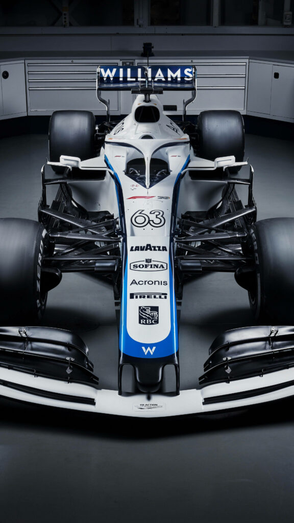 Williams Formula 1 car number 63 in white with blue accents in modern aerodynamic garage background Wallpaper