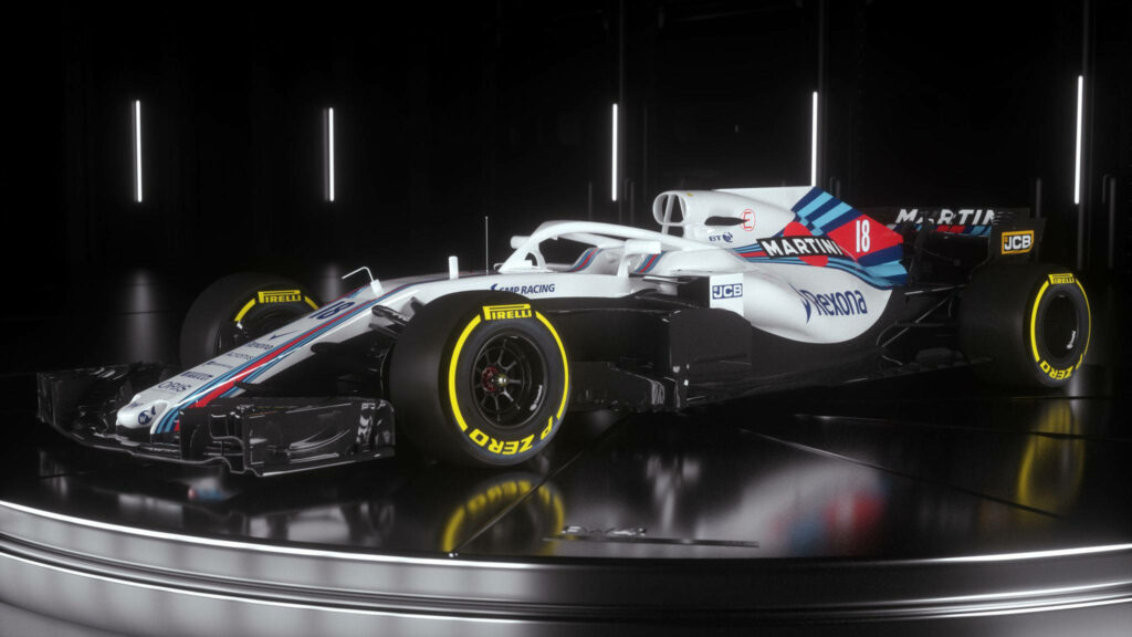 Williams Formula 1 car with black yellow Pirelli tires white blue red livery on glossy platform Wallpaper