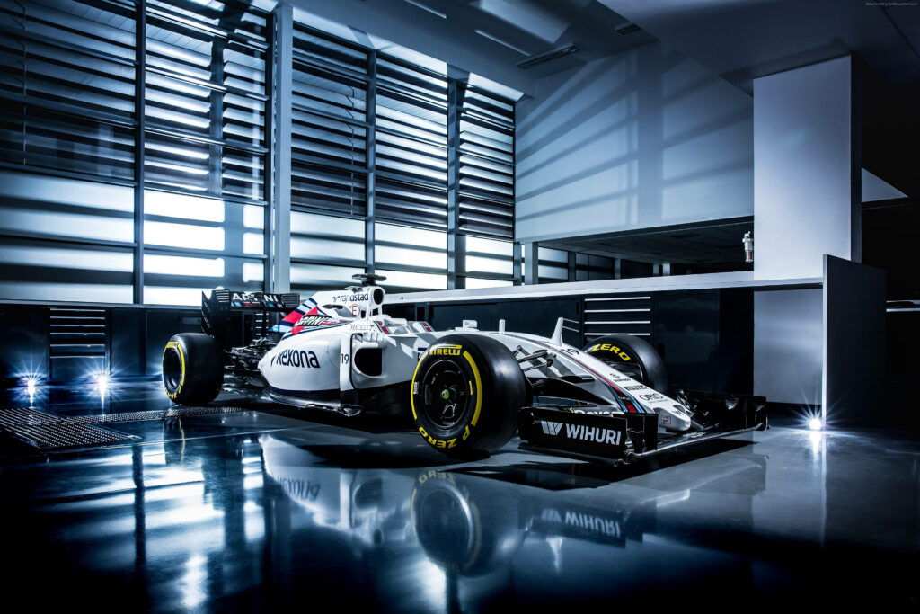 Williams Formula 1 car in modern garage with reflective floors and dramatic industrial lighting Wallpaper