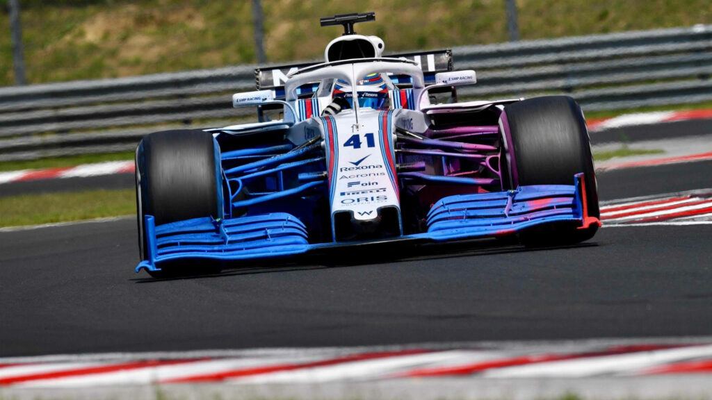Williams Sports Car 41 racing fast with blue white purple livery blurred track background wallpaper