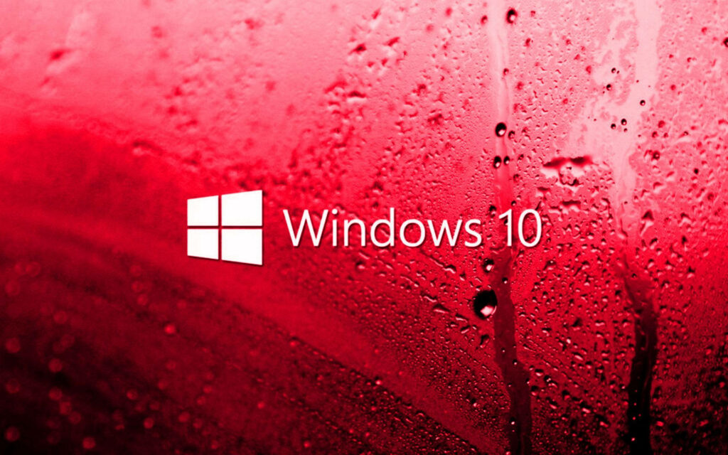 Vibrant Windows 10 HD Wallpaper featuring the Iconic Logo Amidst a Crimson Glass Backdrop