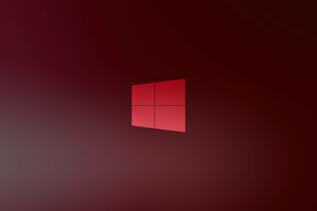 Vibrant Windows 10 Logo Shines on Elegant Wine Background - Captivating HD Desktop Wallpaper